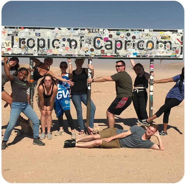 Students at Tropic of Capricorn during study abroad trip